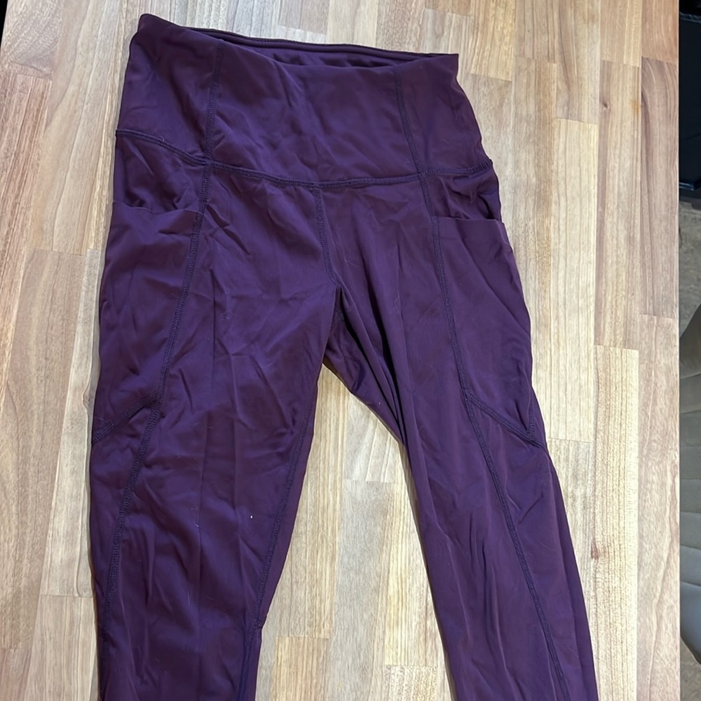 Women’s size small purple members mark ankle leggings